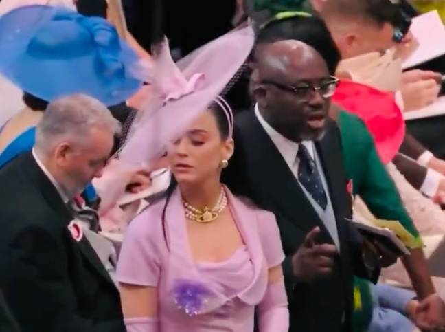 Katy Perry has left viewers in stitches as she struggles to find a seat at Westminster Abbey during King Charles III's historical coronation today (6 May). Credit: BBC
