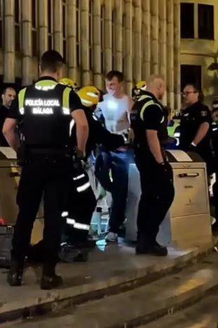 TrivDaily - Brits try to rescue friend trapped in underground Malaga bin after drunken prank goes wrong 60 Freeing Tiggy was quite an operation. Credit: Solarpix