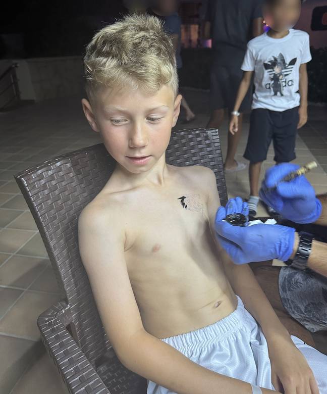Ollie had a henna tattoo while on holiday with his family. Credit: Kennedy News and Media