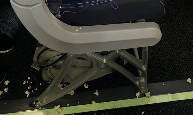 The popcorn was scattered around the plane floor. Credit: Twitter/@AnthonyBass52