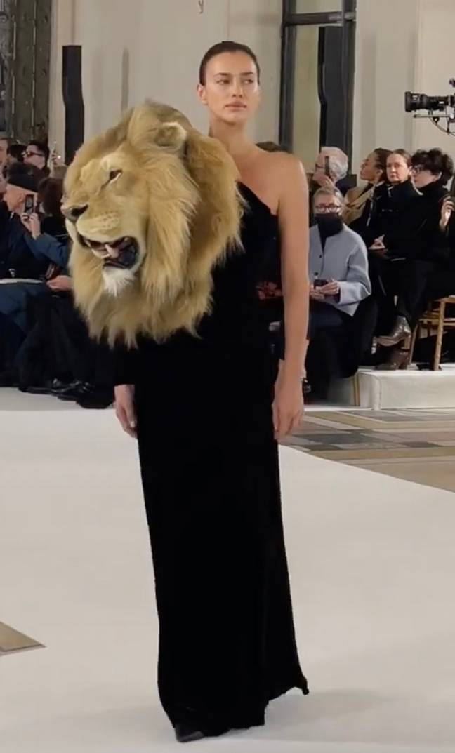 37-year-old Irina Shayk wearing a couture black gown fitted with an embroidered lion head for the Schiaparelli show. Credit: Instagram/@leoniehanne