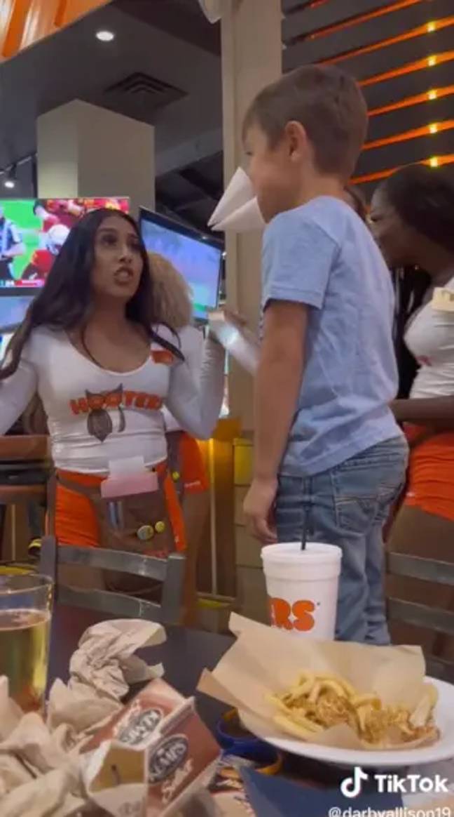 Parents are divided over whether it's appropriate for a young boy to have his fifth Birthday party in a Hooters. Credit: TikTok/@darbyallison19