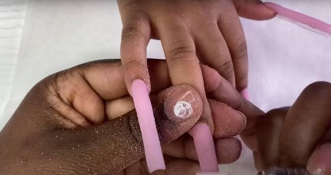 The YouTuber gave her four-year-old daughter acrylic nails. Credit: Just AsiaJJ/YouTube