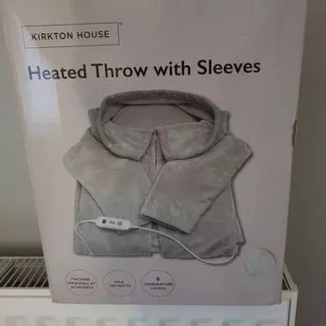 Heated throws aren't expensive to run, including this wearable one from Aldi. Credit: Facebook
