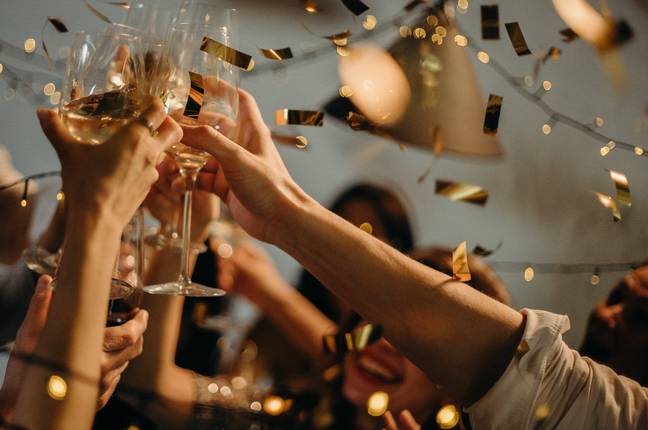 People celebrating with alcohol. Credit: Pexels