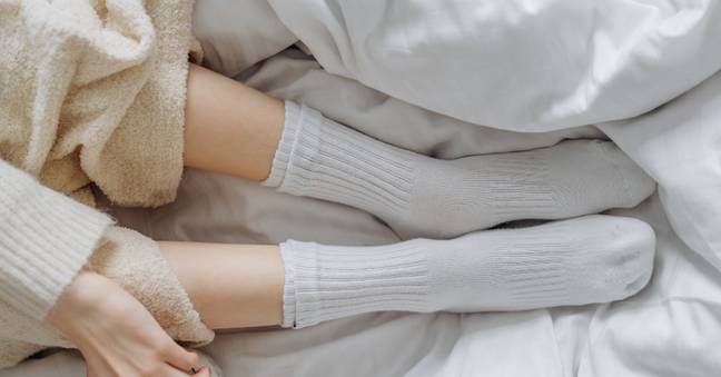 Wearing socks to bed can help you get a deeper sleep. Credit: Pexels