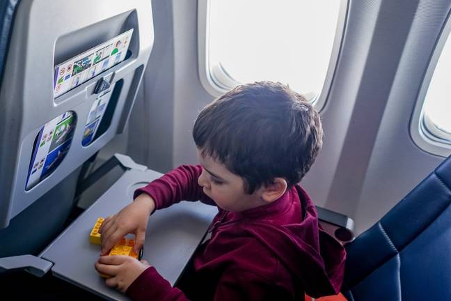 A mum's partners wants her to leave her son in economy while they fly business class. Credit: Pexels/Oleksandr P