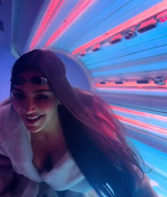 Do you have a tanning bed in your office? Of course, Kim Kardashian does. Credit: TikTok/@kimkardashian