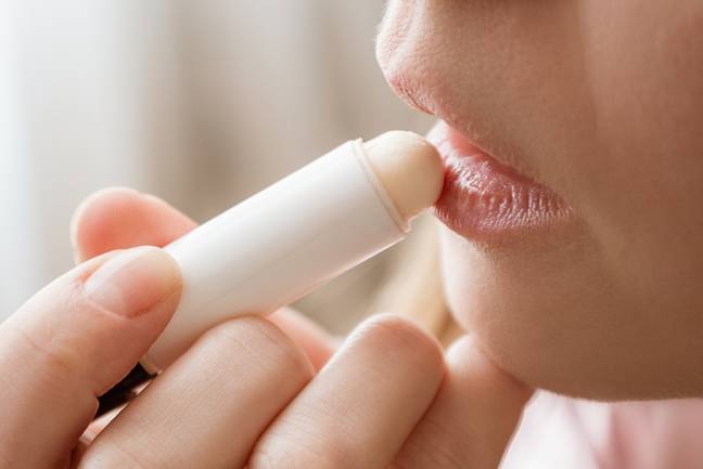 Be sure to pop on some lip balm to help prevent chapping and cracking. Credit: Olga Chetvergova / Getty Images