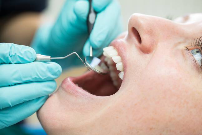 The dentist mapped out several preventative measures to take to avoid the black triangles. Credit: Luis Alvarez / Getty Images