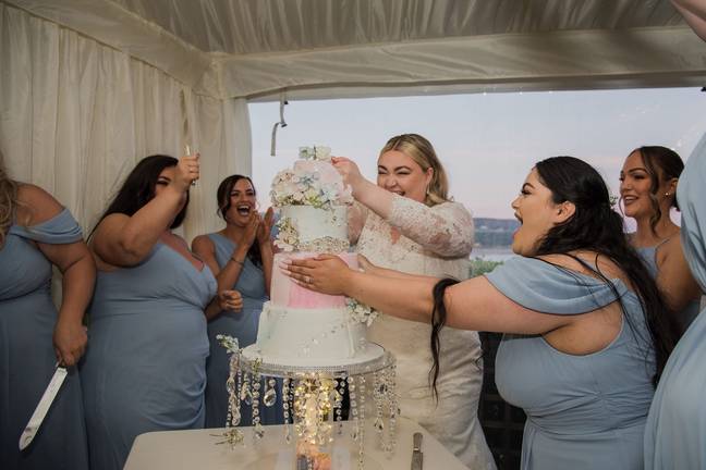 Kayley hilariously punched her groom off her wedding cake. Credit: SWNS