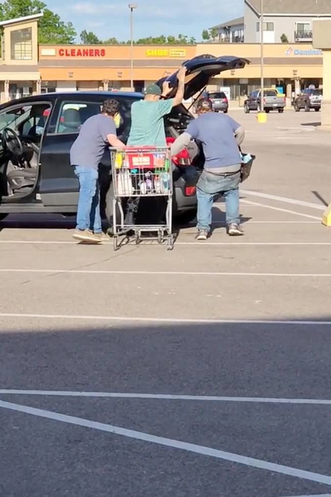 The three men were filmed loading their car with the stolen laundry detergent. Credit: Arapahoe County Sheriff's Office 