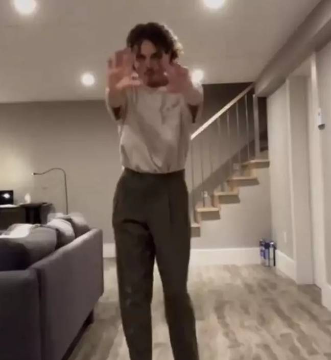 People have spotted a terrifying figure in a video of a TikTok dancer who was home alone. Credit: reu_music/TikTok