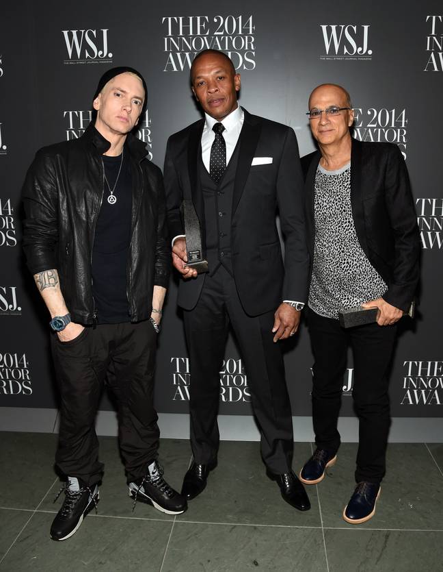 The rapper pictured with Dr. Dre and Jimmy Iovine in 2014. Credits: Jamie McCarthy/Getty Images