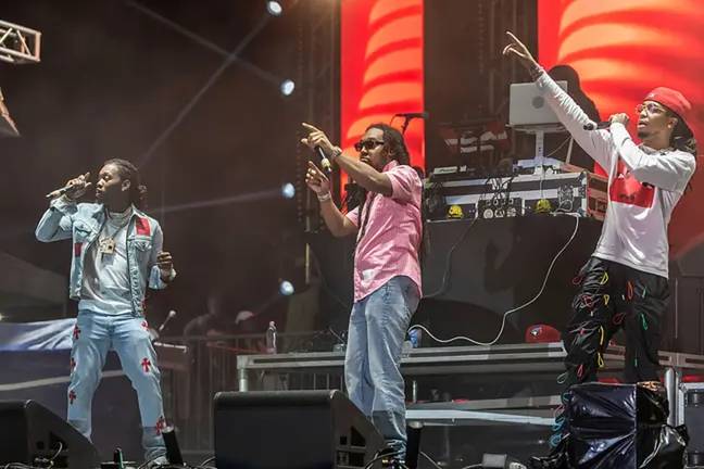 Takeoff (centre) performed alongside his family members as part of group Migos. Credit: The Photo Access / Alamy Stock Photo