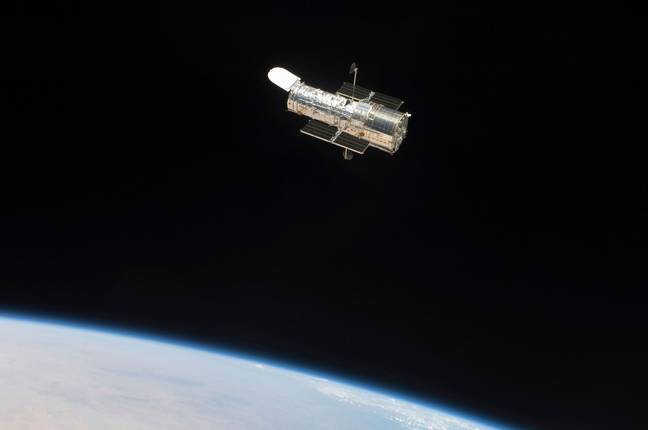 The Hubble Space Telescope in orbit above Earth. Credit: Stocktrek Images, Inc. / Alamy Stock Photo