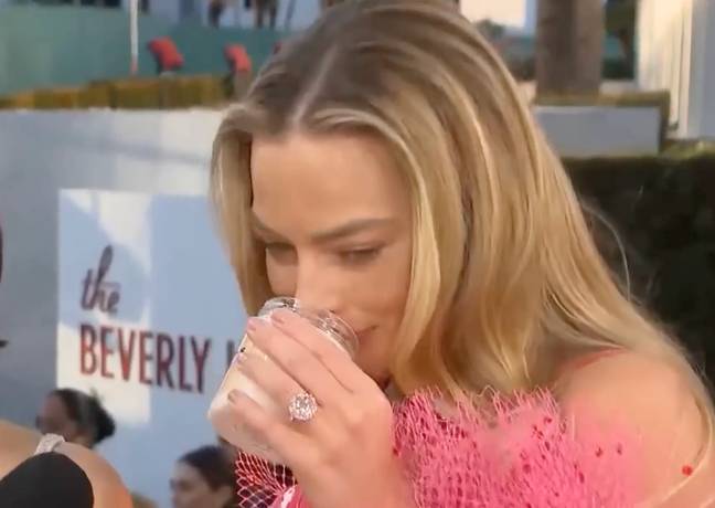 Margot Robbie gave the candle a good sniff. Credit: Entertainment Tonight