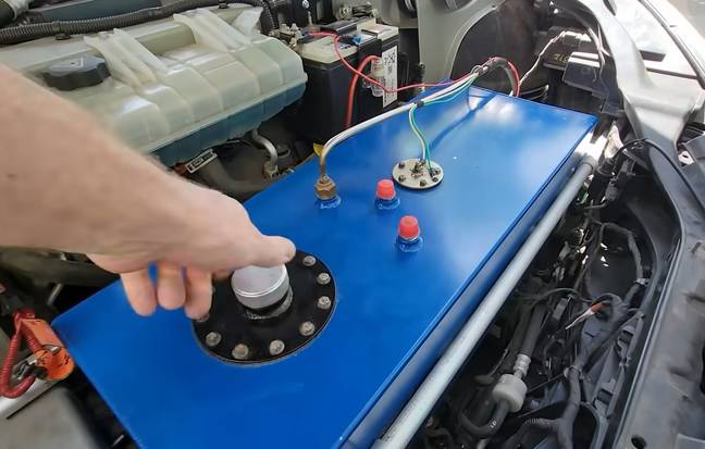 Getting the gas generator into the car took a lot of effort and ultimately this experiment probably won't go down as a success. Credit: YouTube/Warped Perception