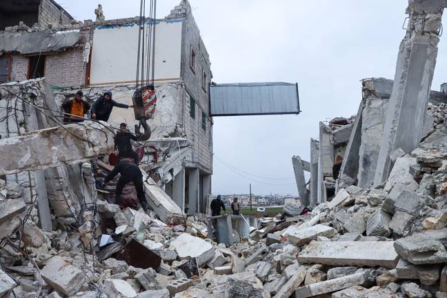 Syrian rescue teams search for victims in the rubble following an earthquake in the northwestern, rebel-held Idlib province. Credit: UPI/Alamy