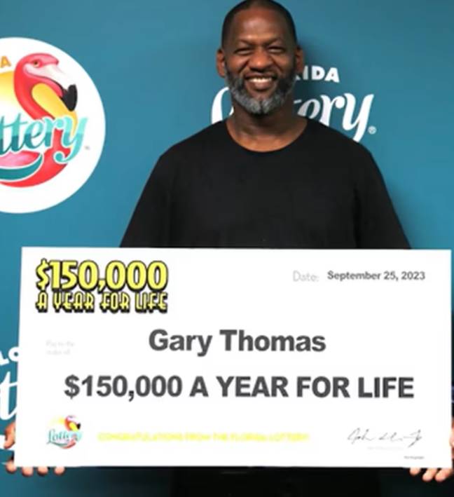 Gary Thomas with his winnings. Credit: Florida Lottery