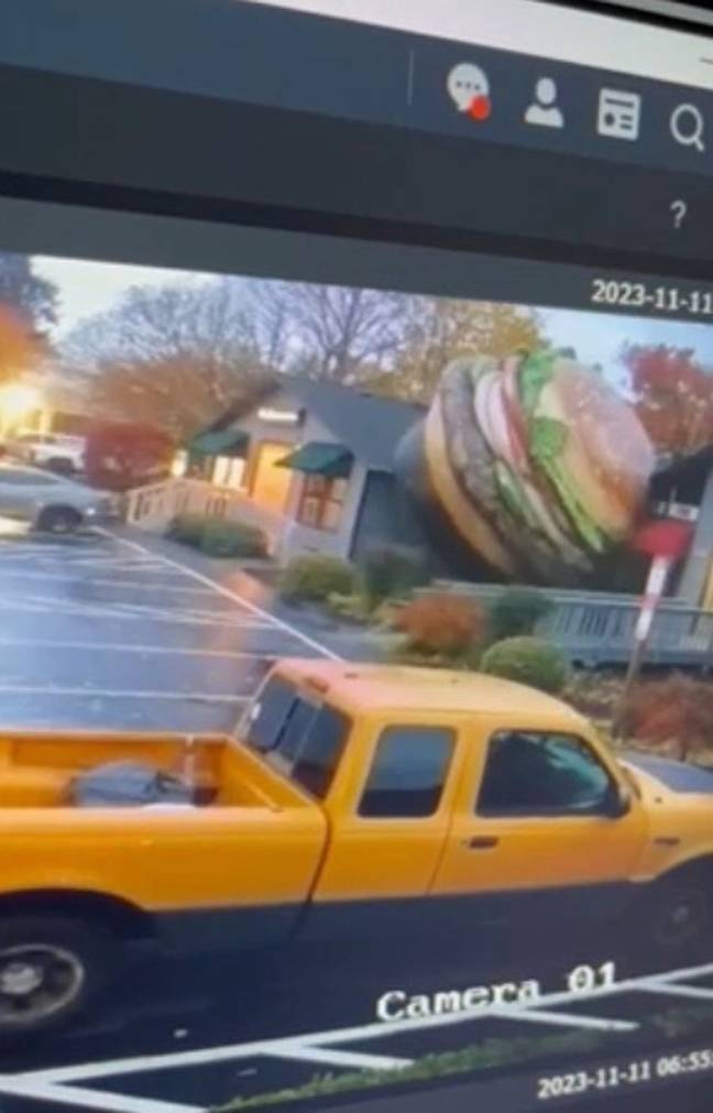 The burger briefly came to rest by a building before being blown away. Credit: KLTV 7