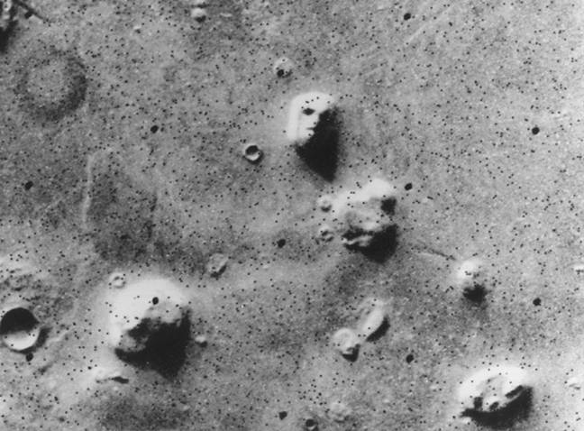 The shadows in the photo showed a 'huge rock formation, which resembles a human head, formed by shadows giving the illusion of eyes, nose and mouth'. Credit: NASA