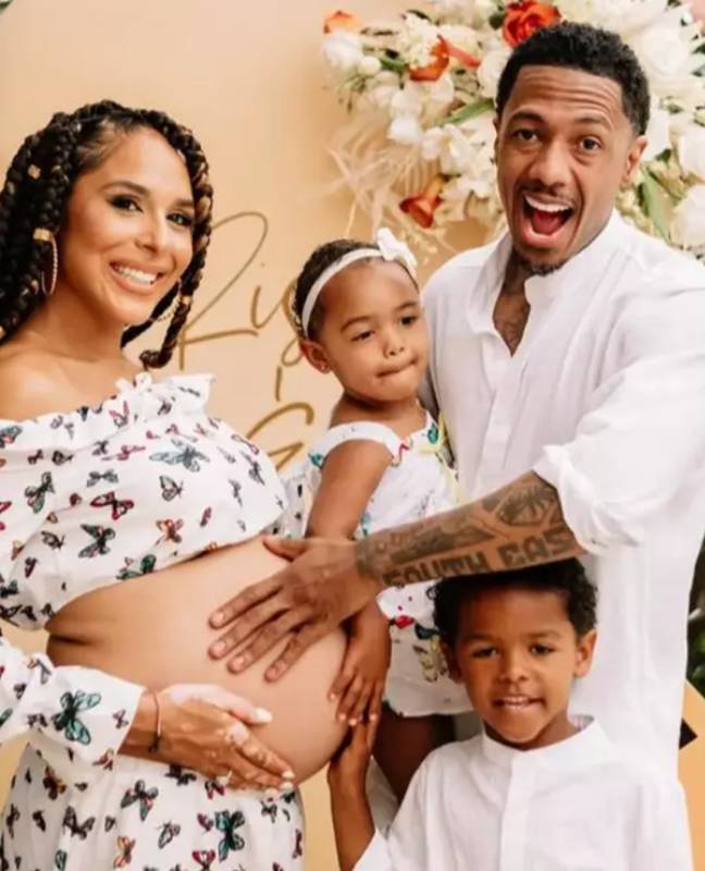 Nick Cannon with Brittany Bell. The pair share three children together. Credit: @amberrainphotography/Instagram.