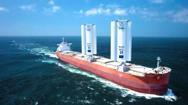 The world's first wind-powered cargo ship has set off on her maiden voyage, using its giant metal 'wings' to fly through the ocean. Credit: PA