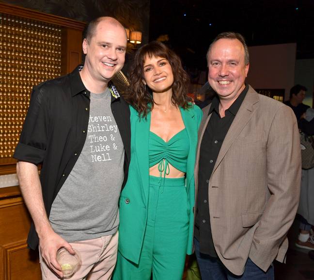 Mike Flanagan (L) and Trevor Macy (R) pictured with actress Carla Gugino. Credits: Emma McIntyre/Getty Images for Netflix