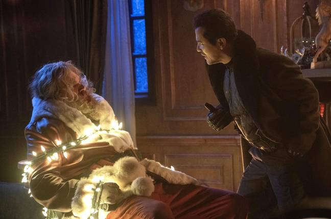 David Harbour's Santa Claus does battle with John Leguizamo's hostage taker in Violent Night. Credit: FlixPix / Alamy Stock Photo