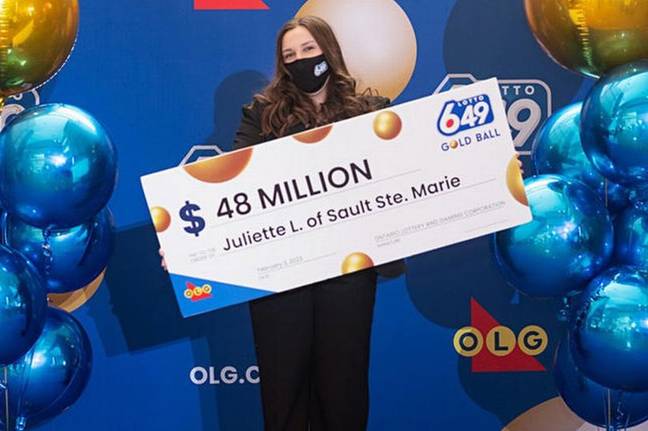 18-year-old Juliette Lamour stood proudly with the cheque for her winning ticket. Credit: Ontario Lottery and Gaming Corporation