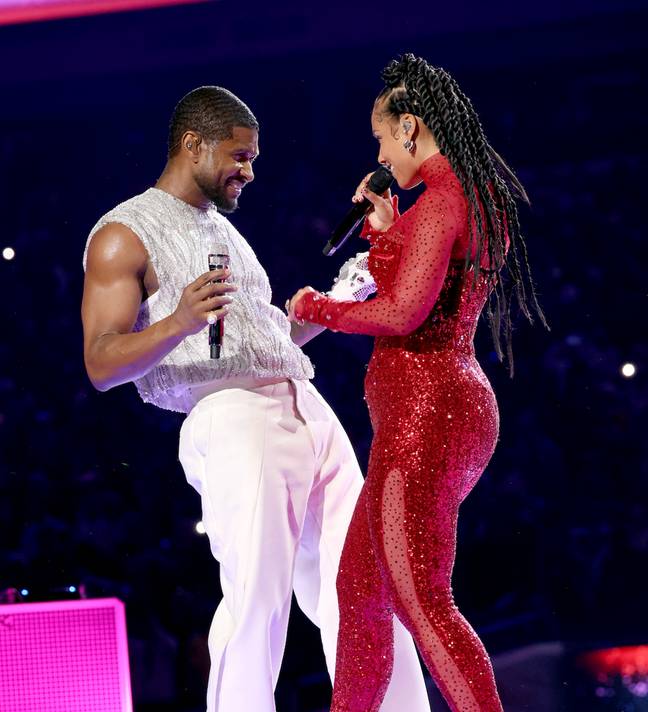 Usher was seen getting mighty close while performing with Alicia Keys. Credit: Ethan Miller/Getty Images