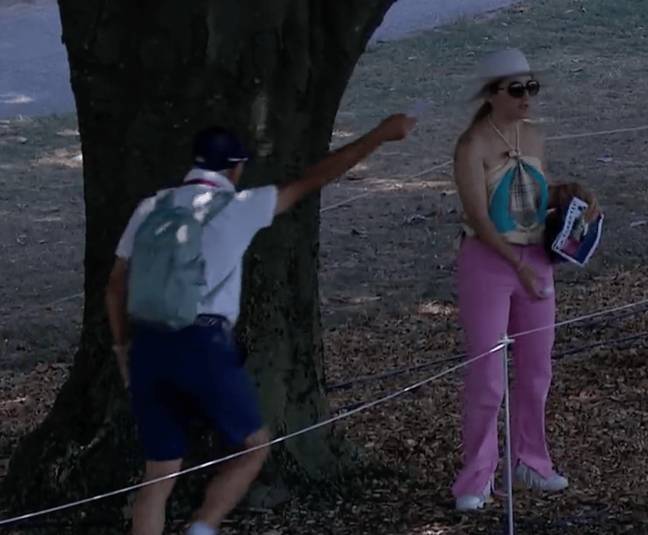 Hilarious moment oblivious spectator picks up player’s golf ball during tournament Hilarious moment oblivious spectator picks up player’s golf ball during tournament