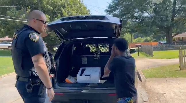 The boy couldn't believe his eyes when he was presented with the PlayStation. Credit: Facebook/City of Hapeville Police
