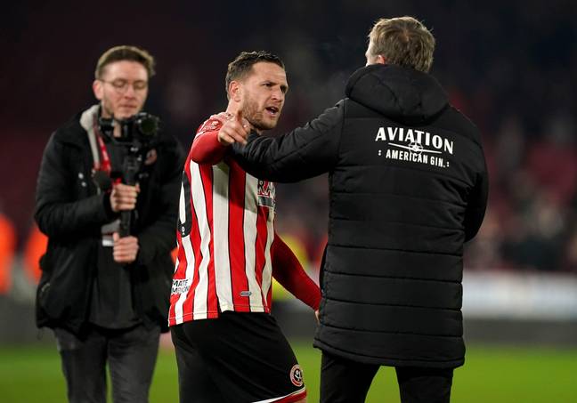 Wrexham manager Phil Parkinson clashes with Billy Sharp at full time after the FA Cup fourth round replay at Bramall Lane. Image credit: Alamy