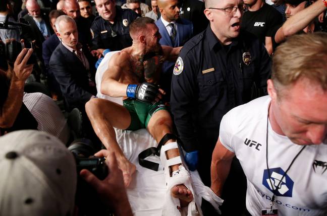 McGregor stretchered off after breaking his leg against Dustin Poirier. Image: PA Images