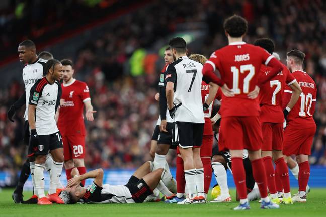 Andreas Pereira lies on the floor after clashing with Virgil van Dijk. Image: Getty