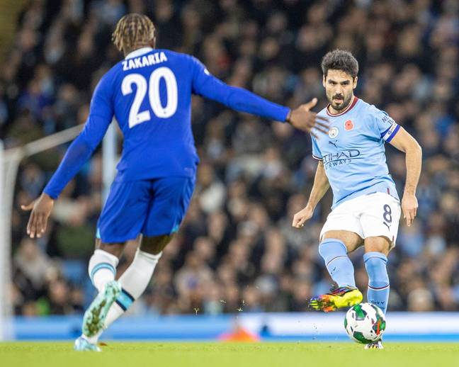 Manchester City versus Chelsea; Ilkay Gundogan of Manchester City crosses the ball past Denis Zakaria. (Alamy)