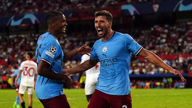 Ruben Dias celebrates with Manuel Akanji after scoring against Sevilla 