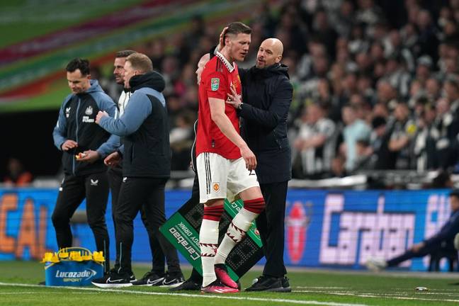 Erik ten Hag and Wout Weghorst share a conversation during the Carabao Cup final. Image: Alamy