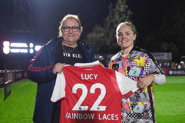 Lucy Clark is presented with a Rainbow Laces Arsenal home shirt by Arsenal captain Kim Little last year (Getty Images)