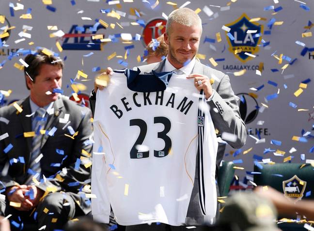 David Beckham holds up the now-iconic number 23 shirt during his LA Galaxy presentation. Image credit: Alamy