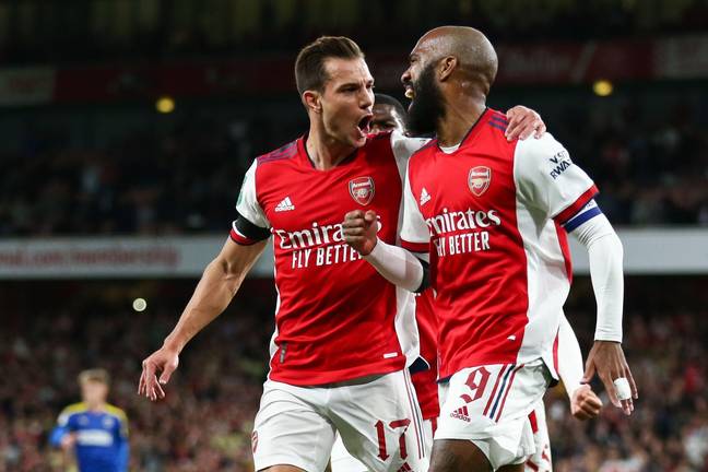 Lacazette and Cedric during a game last season. (Image Credit: Alamy)