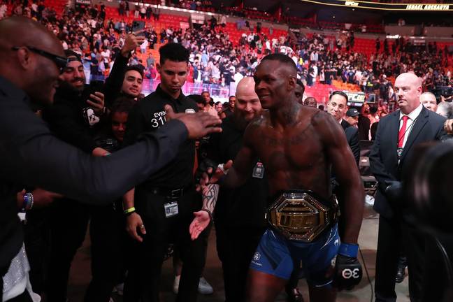 Israel Adesanya celebrates with his win at UFC 287. Image: Alamy 