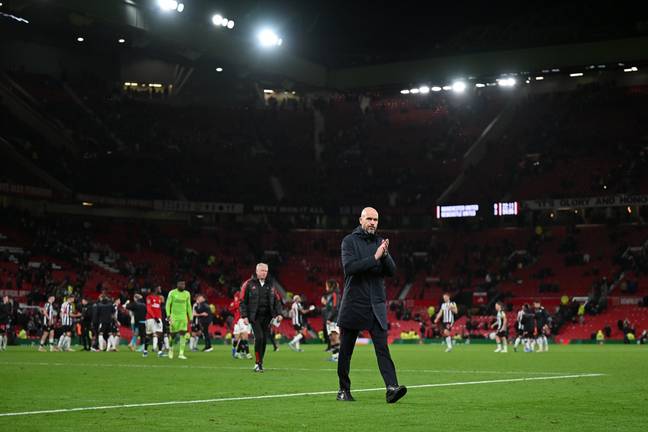 Erik ten Hag leaves the pitch after defeat to Newcastle. Image: Getty