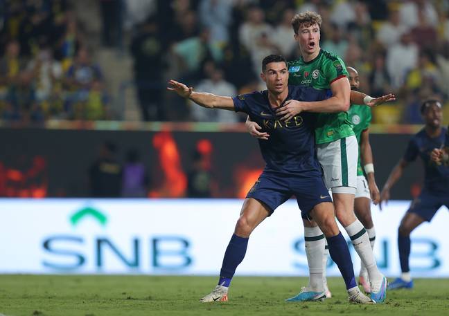 Ronaldo and Hendry during the game. (Image Credit: Getty)