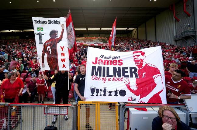 Fnas held up banners for James Milner and Roberto Firmino in the final home game of the season, with both set to leave this summer. (Credit: PA Images)