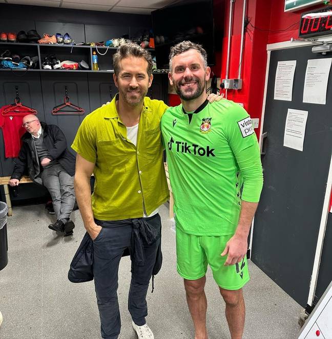 Foster and Reynolds pose for a picture together after securing promotion. Image: Ben Foster