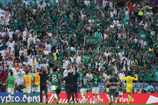 Saudi Arabia players celebrate with their fans at full time. Image: Alamy