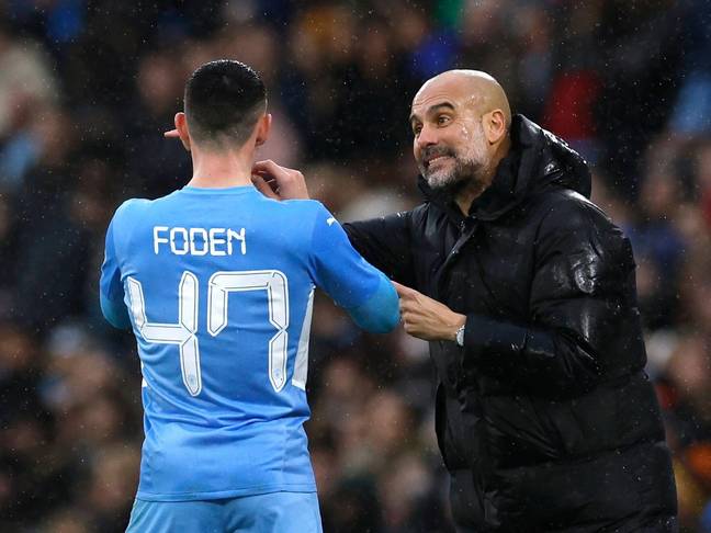 Pep Guardiola speaks to Phil Foden during a game. Image: Alamy 